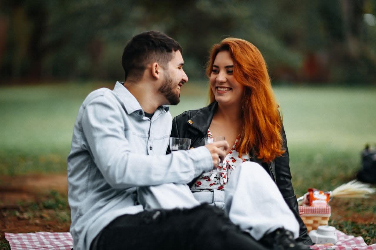 man-and-woman-drinking-wine-at-a-picnic
